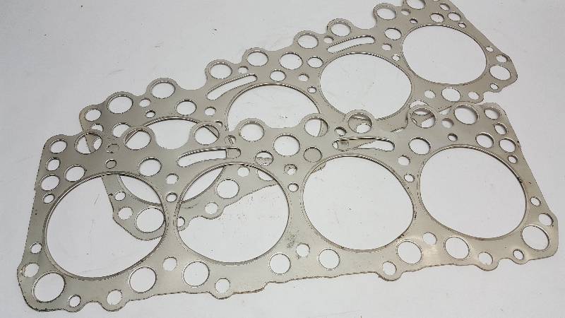 lot 7381 image: NOS pair of 1954 55 56 324 cubic inch Oldsmobile OHV V8 head gaskets Victor part # 1096