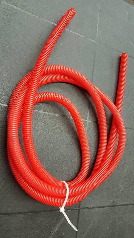 lot 7257-2 image: 10 foot roll convoluted plastic tubing Red but looks Orange wire covering 12 ID