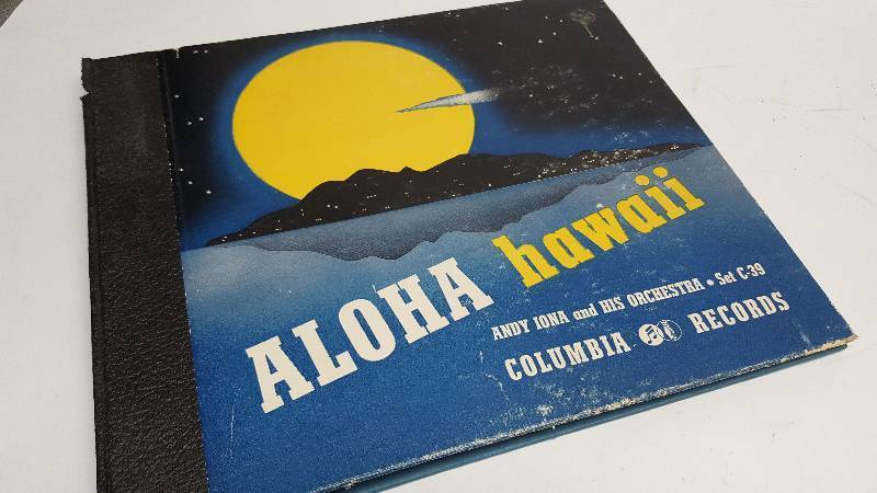 lot 7334 image: Heres the empty album binder cover thats not related to the other 78 RPM vinyl records.