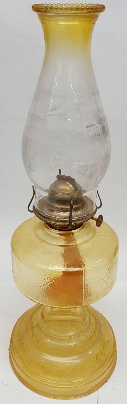 lot 6900 image: All glass and about 18 overall height with the glass chimney is this very nice old oil burning lamp