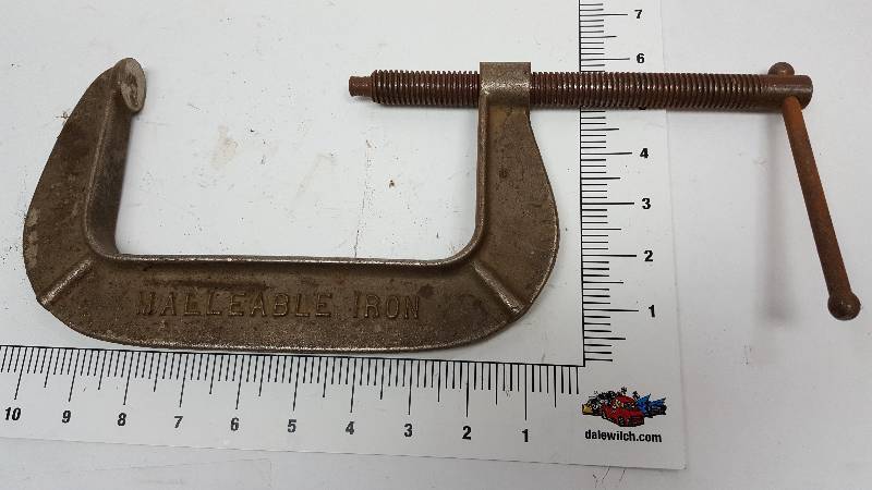 lot 6967 image: Handy to just have in the shop or tool box is a C Clamp.  The lay out template will show you the size