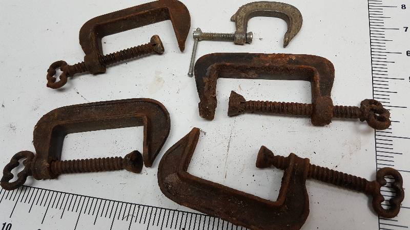 lot 6974 image: Handy to just have in the shop or tool box is this assortment of smaller C Clamps.  The lay out template will show you the size