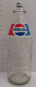 lot 39406 image: VINTAGE 1970S COLLECTIBLE 2 LITER GLASS PEPSI COLA BOTTLE SWIRL