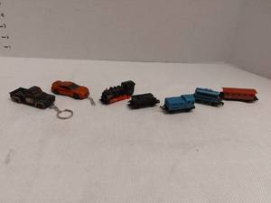 lot 39432 image: Mix of 2 Key Chains and Some Trains