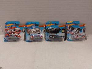 lot 39513 image: 3 International Short Card Super Chromes and 1 Batman Hot Wheels Vehicles