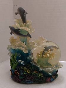lot 39536 image: Musical, Animated Dolphin Figurine