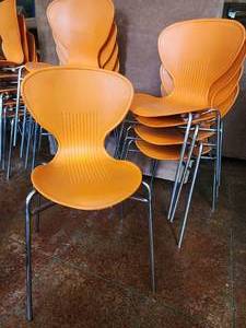 lot 47307 image: Lot of 5 Orange And Metal Stackable Chairs