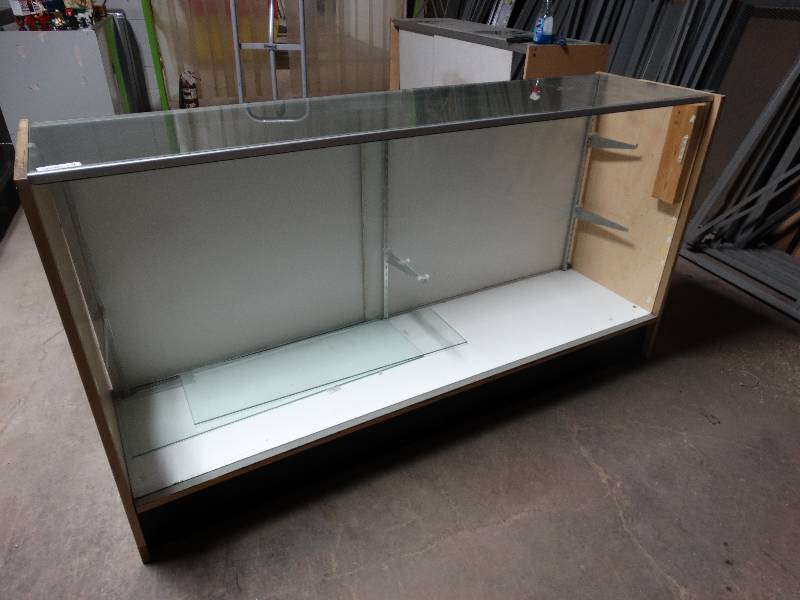 lot 437 image: Full front glass showcase with sliding back doors.