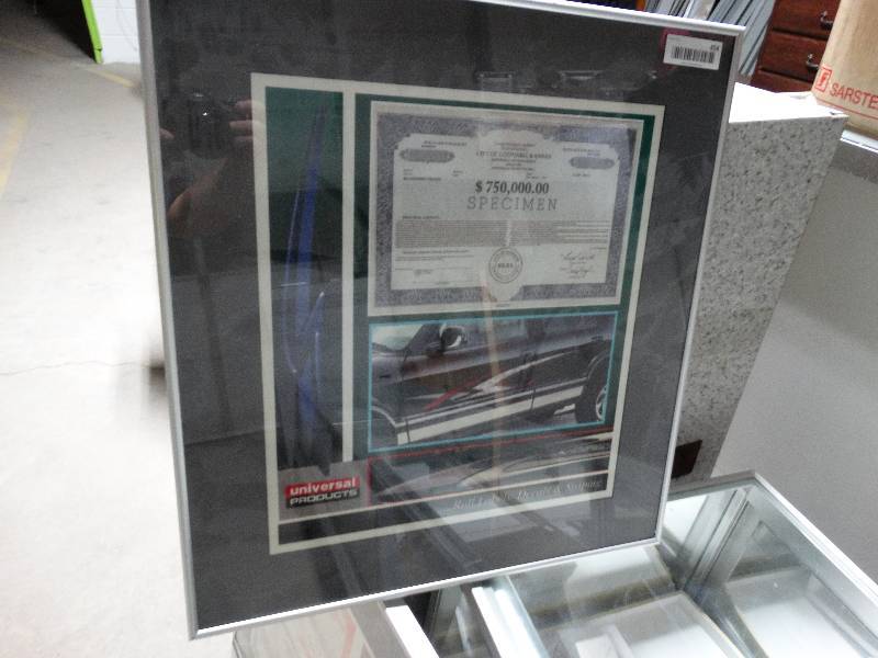 lot 454 image: Framed copy of Universal Products, city of Goddard $750,000 revenue bond certificate