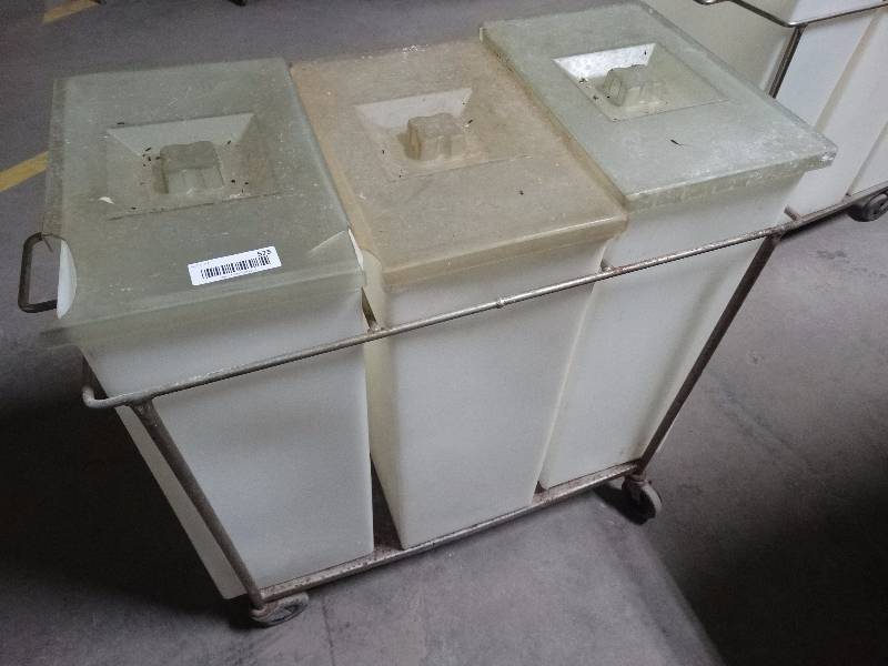 lot 525 image: 3 ingredient bins in metal rack on wheels.