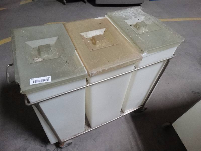 lot 526 image: 3 ingredient bins in metal rack on wheels.