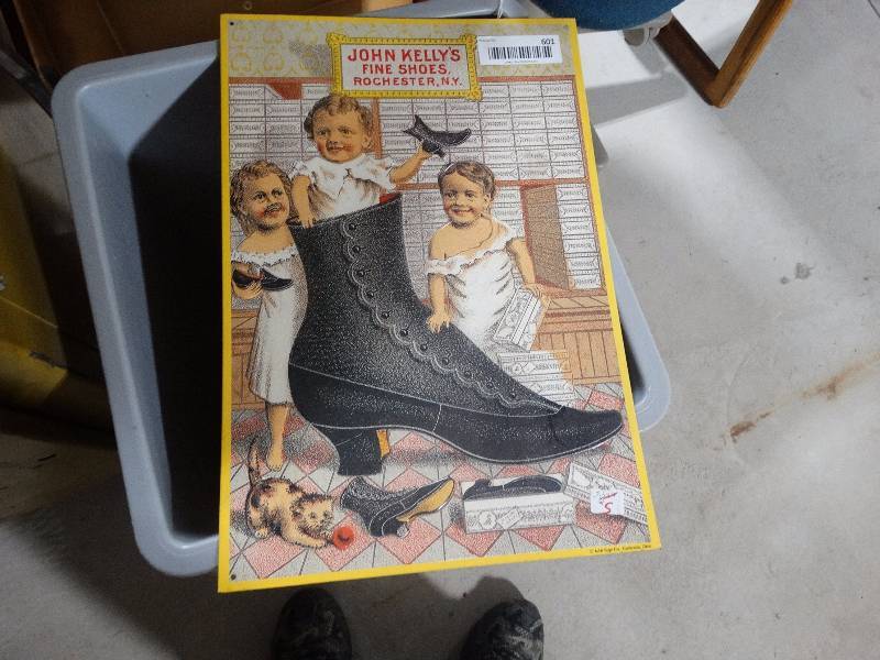 lot 601 image: metal shoe company sign