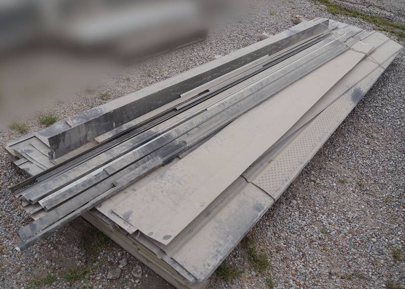 lot 4073 image: Lot of Sheet Metal Siding Pieces  - Longest pieces are 145 - Theres construction dust on this � The color is a dark browngray. Nice lot of siding supplies