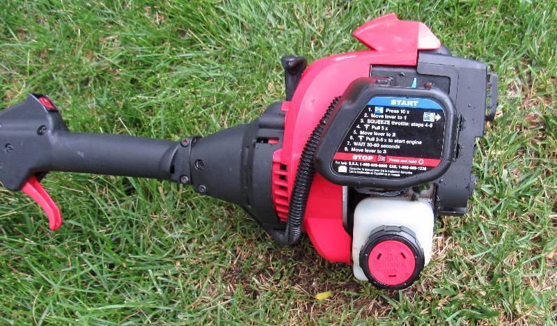 lot 7693 image: Troy-Bilt Gas Weed Eater - Like New