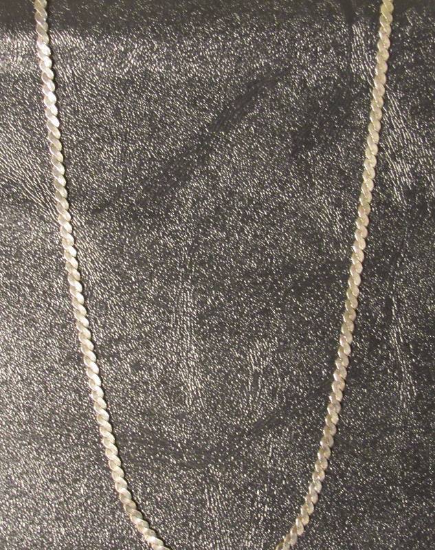 lot 7717 image: Silver braided chain - doesnt appear to be white gold