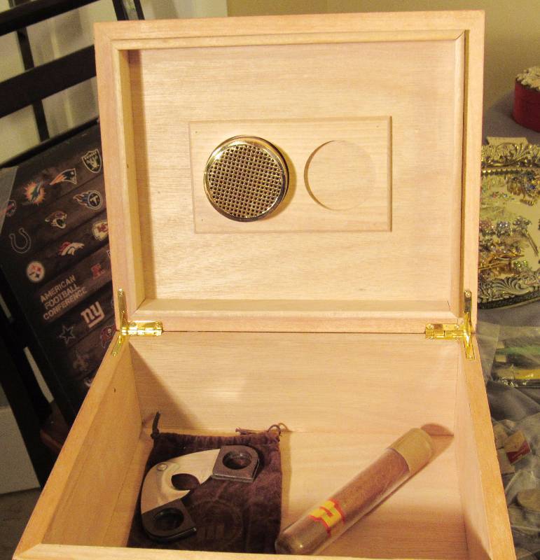 lot 7751 image: Cigar Humidor with Cigar Cutter and Cigar - Decorative Cover plate says 1915 THOMPSON & CO. INC. - Nice See photos for size and style