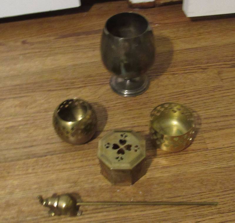 lot 7772 image: Lot of Candle Accessories - 3 brass candle holders, brass flame snuffer, silver copper wine cup