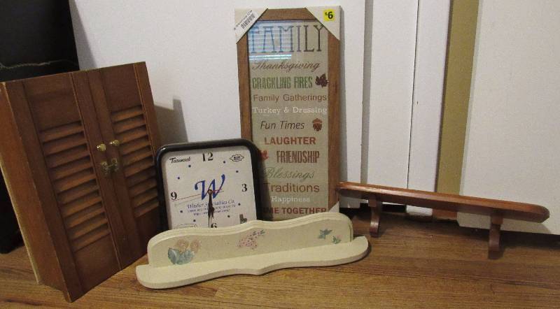 lot 7779 image: Lot of home dcor - 2 wooden shelves, FAMILY word art framed - Clock and cabinet