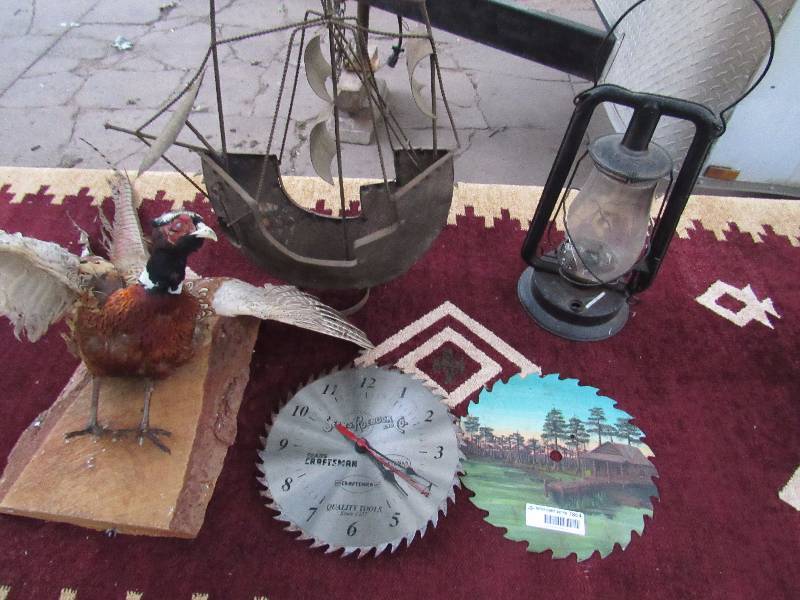 lot 7864 image: Lot of Masculine Home Dcor - Taxidermy Pheasant - Saw Blade Clocks - Pirate Ship and Vintage Metal Oil Lamp