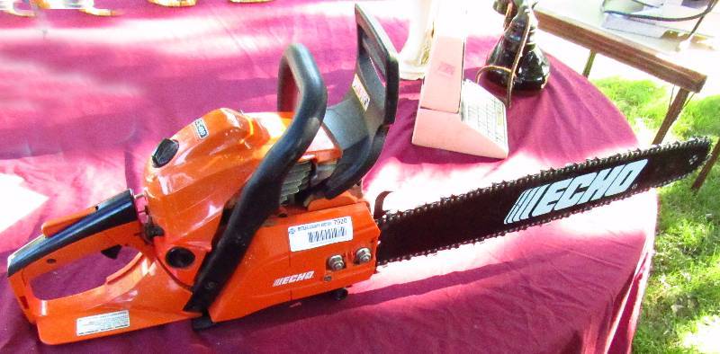 lot 7920 image: ECHO - Chain Saw - Near New Condition M# CS-490