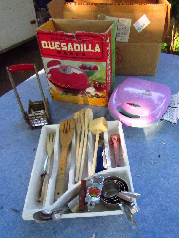 lot 2089 image: Lot of Small Kitchen Appliances - Quesadilla Maker, Utensil Holder, Kitchen Utensils (shown), Measuring Cups, French Fry Cutter, Donut Baker - Fun in the Kitchen Mmmmmmm