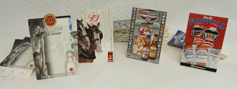 lot 2383 image: Lot of Vintage Bar Table Tents - Budweiser - Bud Light - Bacardi NEW See photos for style and quantity