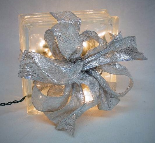 lot 2118 image: Glass Block Art with Lights and ribbon - decorated like a Christmas present decoration - Pretty