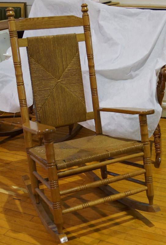 lot 9241 image: Rocking Chair - Wood w wicker covered seat and back - Great Condition - See Previous Lot for matching chair - VERY NICE