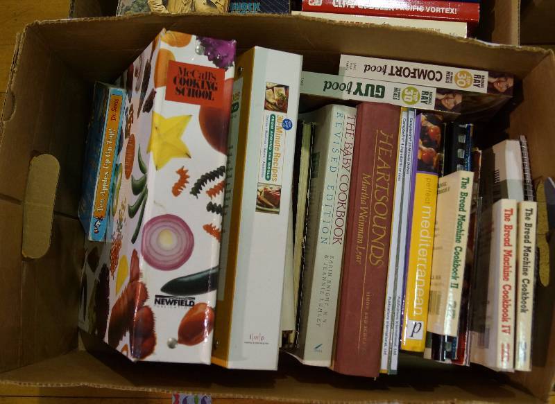 lot 2176 image: Lot of 2 boxes of books - 1 is Mostly CLIVE CUSSLER - The other is Mostly CookbooksRecipes - See photos for Details