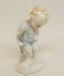 Porcelain Figurine - Little Boy with shovel looking down - Marked on bottom 