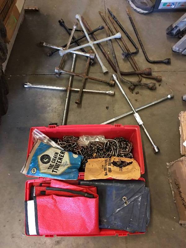 lot 143 image: Lot of tire irons and tire chains
