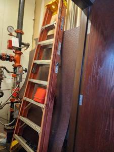 lot 21584 image: Contents of Closet Including A Ladder, Mops, and More