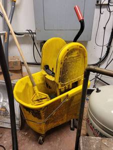 lot 18674 image: Yellow Rubbermaid Mop Bucket and a Black 30in Carlisle Trash Bin