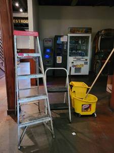 lot 18685 image: Yellow Libman Mop Bucket and 2 Step Ladders