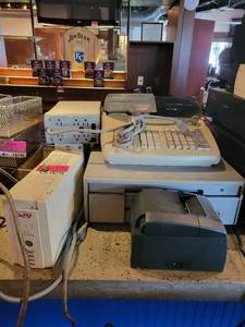 lot 18748 image: Contents on Bar Top - Casio PCR-T2000 Cash Register, APC CS 350 Battery Back-Ups, Epson Receipt Printers, and More
