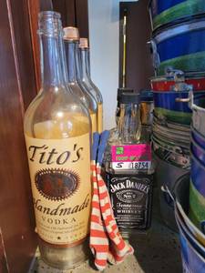 lot 18754 image: Lot of 5 Bottles - Titos and Jack Daniel Whiskey Oversized Promotional Bottles
