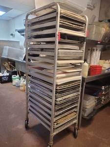 lot 18657 image: Contents of Sheet Pan Rack - Aluminum Full Sheet Pans, Aluminum Half Sheet Pans, Cutting Boards, and More