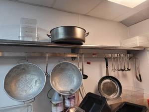 lot 18668 image: Contents of Shelf - Large Colanders, Assortment of Pots  Pans, Soup Ladles, and More