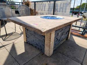 lot 29075 image: Stone Fire Pit That Was Originally Propane Was Converted to Natural Gas