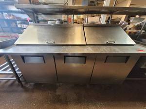 lot 18600 image: Commercial True TSSU-72-3MB-ST 3-Door Mega Top Refrigerated Sandwich Prep Table&nbsp