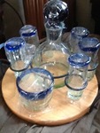Set of glass cordials with serving tray and iron holder