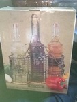 Inbox glass canisters with wire holding rack very nice one bottle missing cork