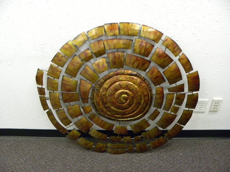 lot 7008 image: 45 Round Painted Sheet Metal Art. Fossil Inspired.