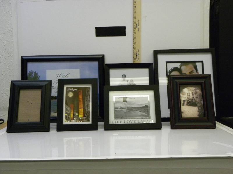 lot 7052 image: 7 Assorted Size (mostly) black picture frames.
