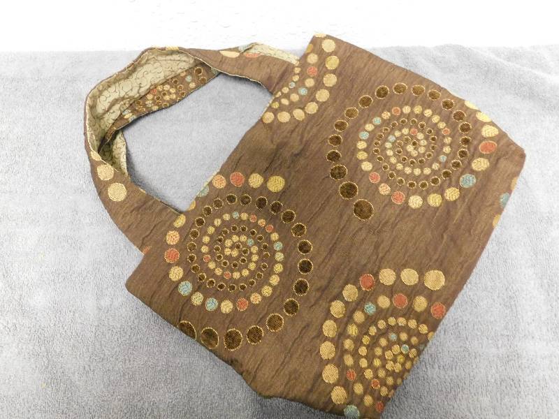 lot 7187 image: Hypno-Fossil Inspired Cloth handbag.