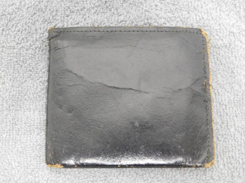 lot 7181 image: Antique Cowhide Leather Wallet.