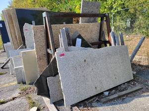 lot 7002 image: Assorted Lot of Remnants - Granite, White Tiger, Quarts, and More