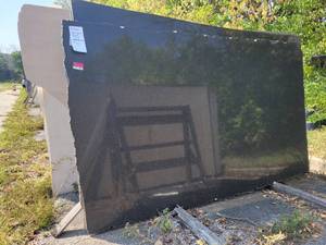lot 7012 image: 4 Slabs of Polished Black Pearl Granite Slabs
