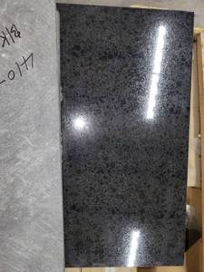 lot 5629 image: Crate of Black Absolute Black 18 X 18 Granite Tiles