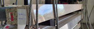lot 5891 image: Am Assortemnt of Polished Granite Back Splashes - Almond Mauve, Tiger Yellow
